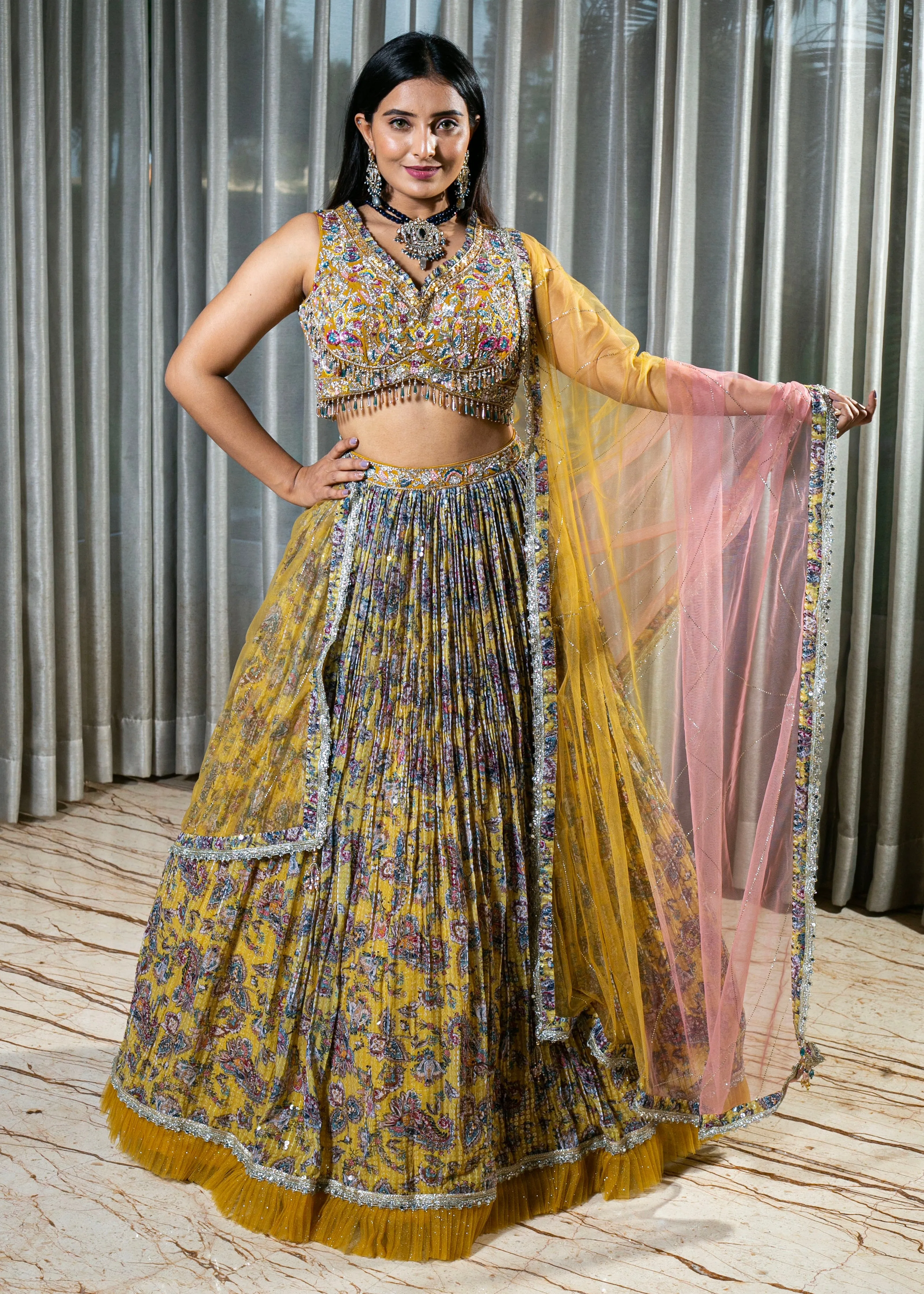 Flared Yellow Lehenga with Intricate Embroidery and Net Dupatta